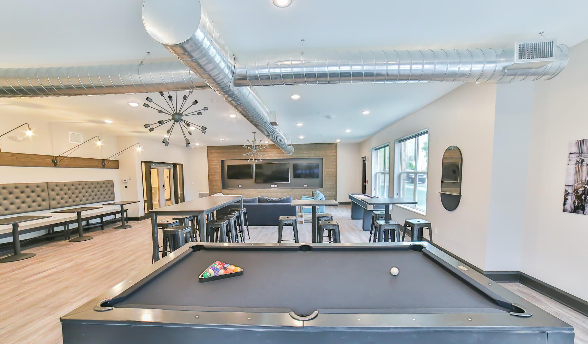 Community room with pool table and plenty of seating